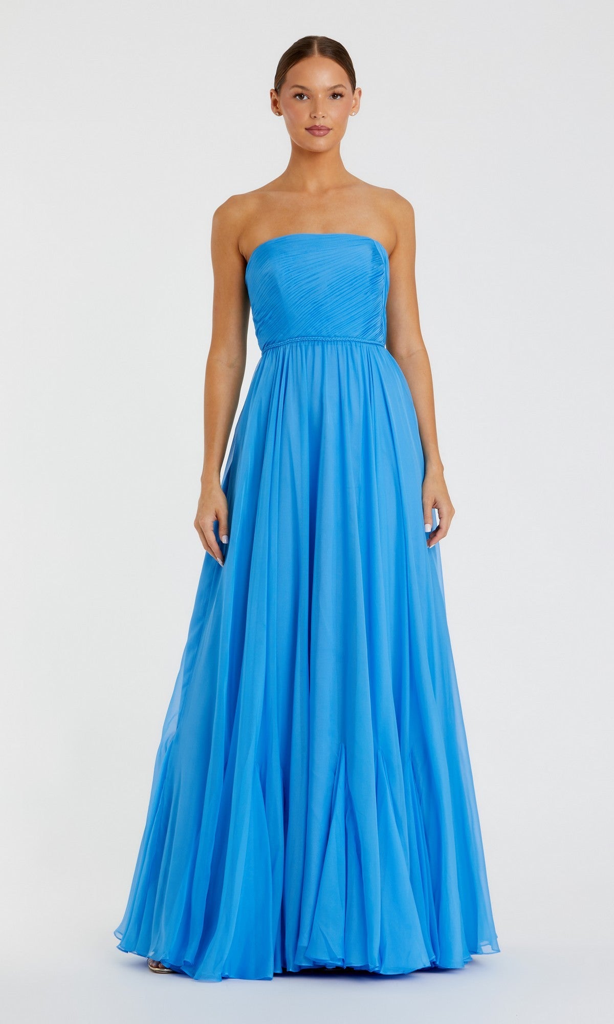 A woman stands facing forward, wearing the Mac Duggal 68847 Long Formal Dress. The strapless chiffon gown in vibrant turquoise features a fitted bodice and an elegant, flowing A-line skirt that gracefully reaches the floor.